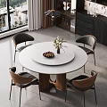 Modern Restaurant Interior With Round White Dining Table Fruit Platter Flower Vase Black Brown Chairs