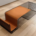 Sleek Modern Coffee Table With Black Metal Wire Frame And Orange Cushioned Top