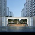 Modern Entrance Gate With Marble Structure And Greenery Near High-Rise Buildings