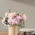 Beige Vase With Pink Purple Roses Hydrangeas And Green Leaves On Table
