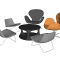 Modern Accent Chairs in Gray and Orange with Round Black Coffee Table
