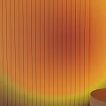 Modern Black Floor Lamp on Round Table with Warm Orange Glow against Vertical Striped Wall