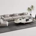 Modern Gray Sofa with Multiple Cushions and Round Coffee Tables with Metal Bases and Ottoman