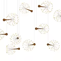 Multiple Dandelion Shaped Chandeliers With Gold Accents And Bright White Lights Against Black Background