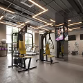 Fitness Gym Interior With Yellow Seated Equipment Mirrors And Floor To Ceiling Windows