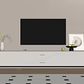 White TV Stand With Flat Screen TV Decorative Vase Fruit Bowl And Artwork