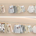 Cute Soft Kids Clothes Display With Light Colors And Cartoon Prints On Hangers