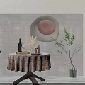 Round Dining Table With Floral Tablecloth Wine Bottle Glass Pampas Grass Candle Holders And Plants