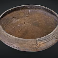 Ancient Clay Bowl With Intricate Carved Patterns And Weathered Surface From Historical Artifact Collection