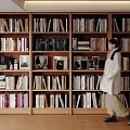 Modern Full Wall Wooden Bookshelf Filled With Various Books And Decorations For Home Study Space