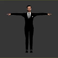 Man in Black Suit Standing with Arms Outstretched Against Grey Background