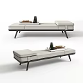 Modern Ottoman With Gray Upholstery Black Metal Legs And Tray With Books And Decorative Items