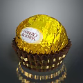 Shiny Ferrero Rocher Chocolate With Golden Wrapper In Brown Paper Cup