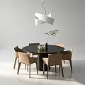 Round Black Dining Table with Six Beige Chairs Green Plant Under Modern White Pendant Light