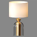 Elegant Modern Table Lamp With White Lampshade Transparent Glass Base And Golden Accents