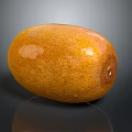 Fresh Ripe Orange Oval Mango Fruit With Smooth Shiny Surface On Dark Background