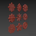 Various Golden Flower Shaped Decorative Ornaments Featuring Intricate Patterns 3d model