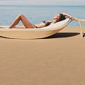 Outdoor Rattan Lounge Chair For Relaxing Beachside With Side Table And Drink