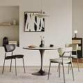 Modern Round Dining Table with Black and Light Chairs Decorative Vase Yellow Flowers and Bowl