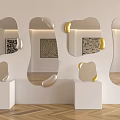 Irregular Shaped Mirrors With Gold Accents On White Pedestals Light Wall And Herringbone Wood Floor