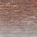 Dining Table Interior Design With Red Brick Wall Background And Decor
