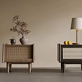 Stylish Light And Dark Wood Bedside Tables With Woven Panels Vase Teapot Lamp And Lemons