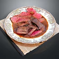 Sliced Juicy Steak With Rich Sauce On Decorative Plate And Bamboo Mat
