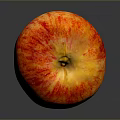 Fresh Juicy Red and Yellow Striped Apple on Smooth Gray Background Surface