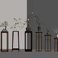 Multiple Wooden Plant Stands of Various Heights With Potted Plants for Indoor Decoration