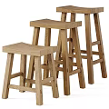 Three Wooden Stools With Different Heights And Natural Wood Finish For Kitchen Bar Use
