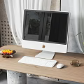 iMac Desktop Computer on Wooden Desk with Fruit Plate Keyboard Mouse and Coffee Cup