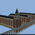 School Building Featuring Red Brick Exterior Blue Roof Spire Towers And Multi Story Connecting Corridor