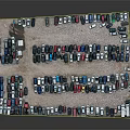 Numerous Parked Cars in Various Colors Arranged in Open Parking Lot
