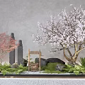 Traditional Courtyard Garden With Pink Cherry Blossom Tree Stone Lanterns Wooden Bucket And Green Plants