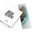 Modern White Trash Bin With Open Top Design Containing Waste and Instruction Manual On Lid