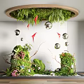Indoor Landscape Featuring Circular Greenery Canopy Hanging Silver Spheres Red Origami Cranes And Ground Plants