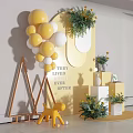 Vibrant Photo Check In Spot With Yellow White Balloons Green Plants And Decorative Props
