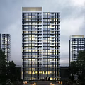 Modern High Rise Residential Building With Glass Windows And Evening Lighting