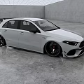 White Mercedes AMG Hatchback With Sporty Body Kit And Black Wheels In Modern Garage