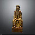Traditional Man In Ancient Robes With Long Beard Wooden Sculpture Sitting On Red Pedestal Base