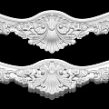 Intricate White Carving Decorative Pieces With Symmetrical Floral And Scroll Patterns