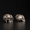 Two Decorative Skulls With Gold Silver Accents Intricate Patterns On Black Reflective Background