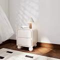 White Bedside Table With Two Drawers Round Legs Lamp Books On Wooden Floor Sunlight Shadows