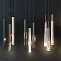 Stylish Pendant Lights Featuring Metal Glass Cylindrical Elongated Designs Illuminated For Modern Spaces
