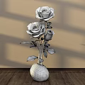 Elegant Floral Display Featuring Black Roses in Silver Vase on Wooden Floor with Shadow Effects