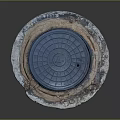 Round Blue Manhole Cover With Grate Design On Concrete Base And Worn Edges