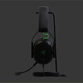 Black Over Ear Gaming Headphones With Comfortable Fit Green Accents Ergonomic Design On Stand