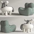 Modern Single Sofa With Green Striped Design Plush White Upholstery And Decorative Throw Blanket