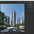 Modern High Rise Residential Buildings Surrounded by Green Trees Under Clear Blue Sky