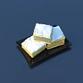 Three Square Flaky Pastry Pieces Topped with White Frosting on Black Plate